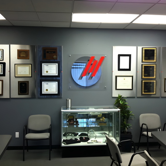 Office Wall Display with Pegboards and Awards - Microtek Laboratories from Anaheim, CA