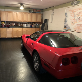 Organized garage with red sports car and storage cabinets - Bill from Falling Waters, WV