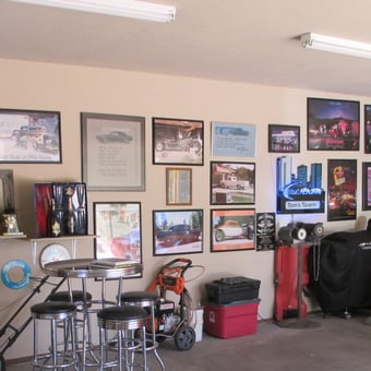 Classic car wall art and neon signs in garage - Tom from Happy Jack, AZ