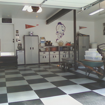 Organized garage with cabinets, storage, and checkered flooring - Rich & Trisha from Milford, PA