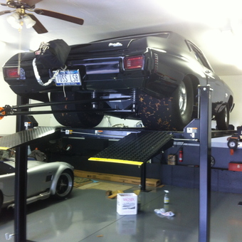 Four post car lift with muscle cars in garage - Brian from Endicott, NY