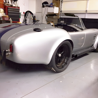Classic silver roadster in organized garage - Brian from Endicott, NY
