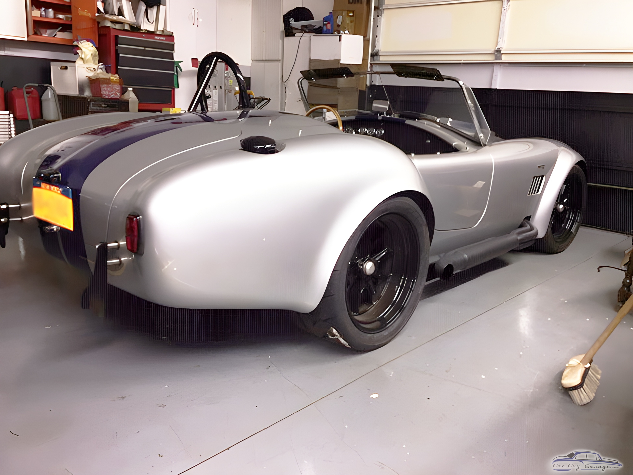 Classic silver roadster in organized garage - Brian from Endicott, NY