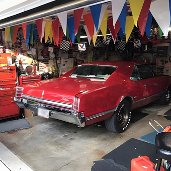 Classic Red Muscle Car in Decorated Garage - Gene from Oakville, MO