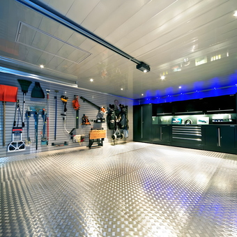 Modern garage with tool wall, cabinets, and LED lighting - Derek from Scotland