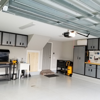 Organized Garage With Cabinets, Workbench, and Tools - CleanFreak from Southport, NC