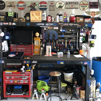 Organized garage workbench with tool chests and decor - Jason from Summerville, SC