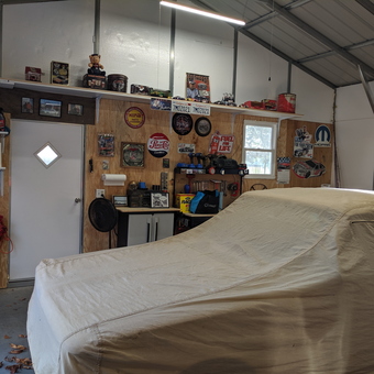 Organized garage with car cover and wall decor - Cheyenne from Greensboro, MD