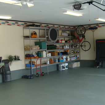 Organized garage with wall shelving, workbench, and bikes - Dave from Port Charlotte, FL