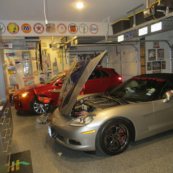 Organized garage with classic signs and Corvette - Grey Eagle from Fulshear, TX