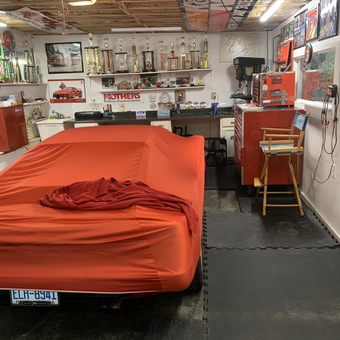 Organized garage with car cover, toolboxes, and trophies - Roland from Tryon, NC