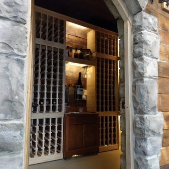 Stone Arch Wine Cellar with Wooden Racks and Cabinet - ci-19404