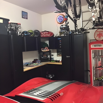 Organized garage with cabinets, bike racks, and Ford sign - Winston from WESLEY CHAPEL, FL