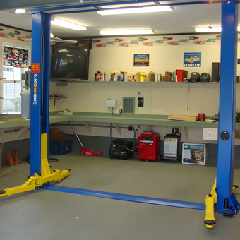 Organized garage with car lift, tool chest, and workbenches - Dave from Port Charlotte, FL