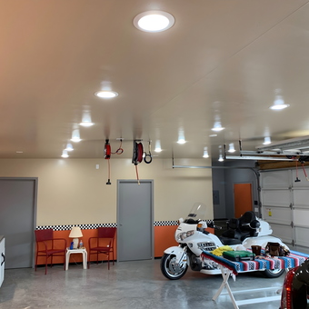 Organized garage with motorcycle, cabinets, hose reels - Cave man from Grover Beach, CA