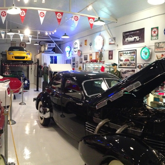 Classic Car Garage with Neon Signs and Memorabilia - Boyd