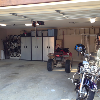 Organized garage with storage cabinets and vehicles - Jim from Hattiesburg, MS