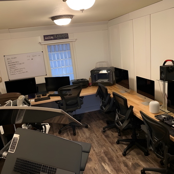 Modern Garage Workspace with Desks and Office Chairs - Rob
