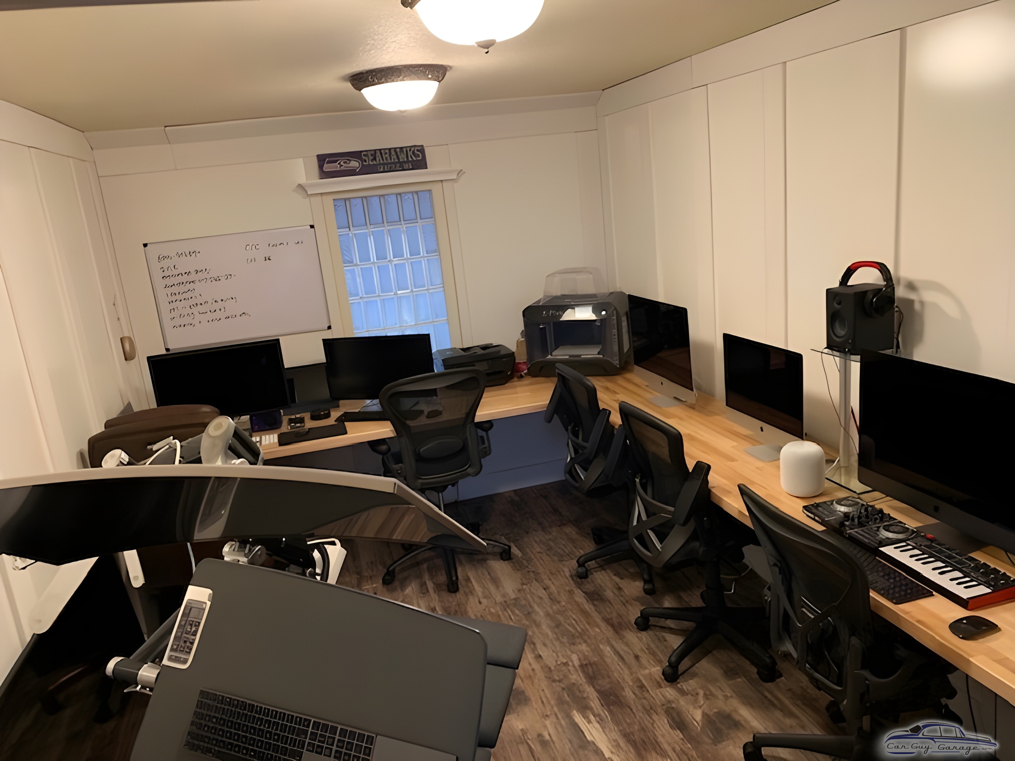 Modern Garage Workspace with Desks and Office Chairs - Rob