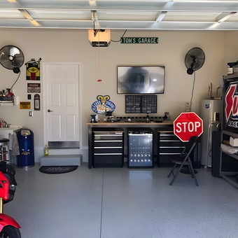 Organized garage with tool cabinets and racing decor - Walter from Coral Springs, FL