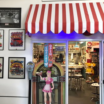 Retro diner garage decor with jukebox and wall art - Terry from Tucson, AZ