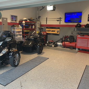 Organized garage with motorcycles, tool chest, and storage - Jason from Rowlett, TX