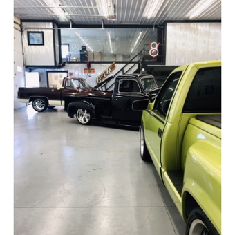 Custom Trucks in Modern Garage with Neon Signs - Tom