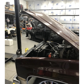 Classic Trucks on Car Lift in Organized Garage - Tom