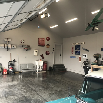 Organized garage with vintage signs and model planes - Mike from Annabella, UT
