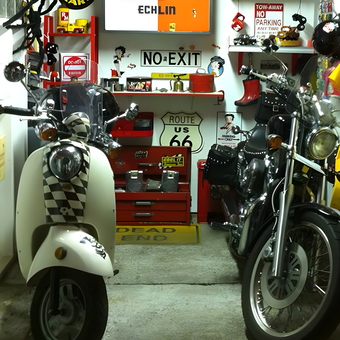 Motorcycles, tool chest, and vintage signs in garage - Sandie from Portland, OR