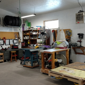 Organized garage with tire racks, tool chests, and lift - Larry from Sun Prairie, WI