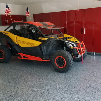 Polished Garage with Red Cabinets and Can-Am Vehicle - Gary and Sandra from Torrington, WY