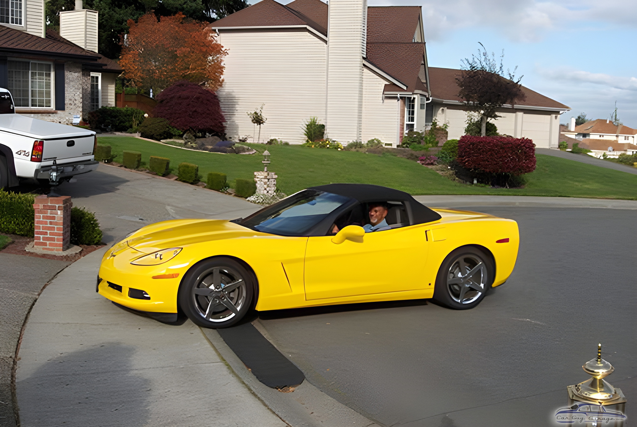 Yellow Corvette Convertible Parked in Residential Driveway