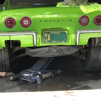 Green Corvette on Floor Jack in Garage - junkyarddogshop from Pittsburg, KS