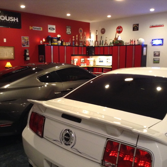 Red garage with Mustangs, cabinets, and wall signs - Steve from Louisville, KY