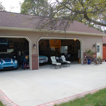 Spacious two-car garage with lifts, bikes, and patio chairs - Paul from Okemos, MI