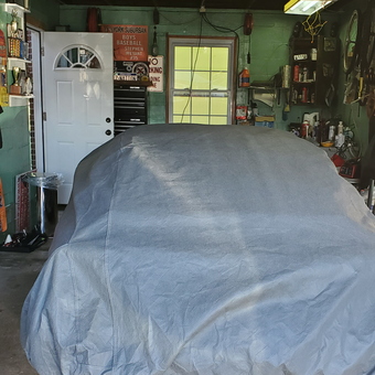 Organized garage with car cover, tool chest, and wall shelves - Stephen from York, PA