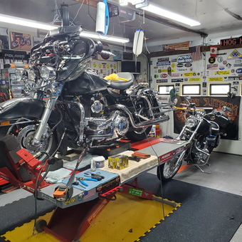 Motorcycle Garage with Lift, Tools, and Wall Decor - IWrench from WINTERPORT, ME