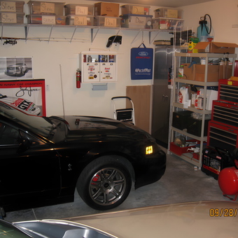 Organized garage with tool chests, storage bins, and car - Dave from Columbia, MO