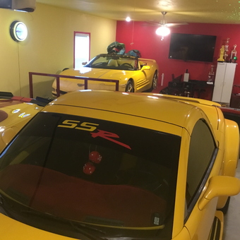 Yellow Sports Cars, Neon Clock, and Trophies in Garage - Billy from North Little Rock, AR