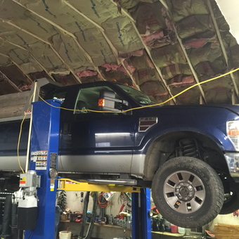 Truck on Two Post Lift in Insulated Garage - BMC from Longs, SC
