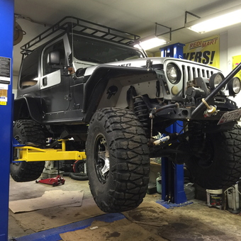 Jeep Wrangler on Two-Post Lift in Garage - BMC from Longs, SC