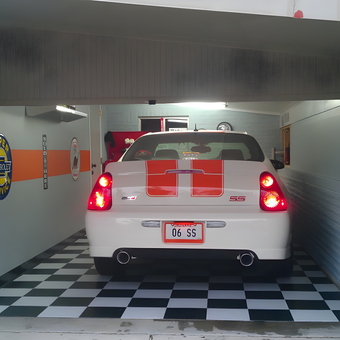 Classic Car Garage with Retro Signs and Checkered Floor - Mel from Marrero, LA