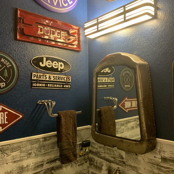 Garage Bathroom with Automotive Signs and Mirror - Dana from Blue Ridge, TX