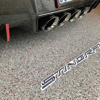 Epoxy Flake Garage Floor With Exhaust and Stingray Emblem - Steve from Olathe, KS