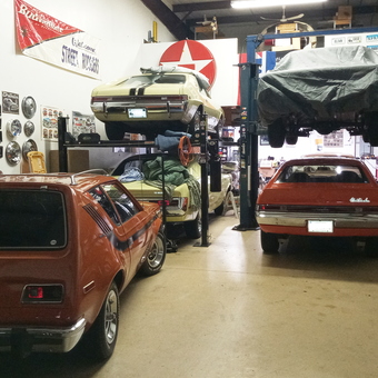 Classic car garage with lifts, wall decor, and hubcaps - Charles from WINDSOR LOCKS, CT