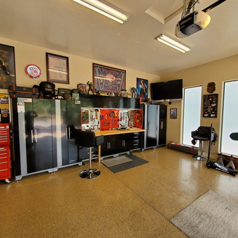 Organized garage with tool chest, cabinets, workbench, and wall art - G2INC. from Prescott, AZ