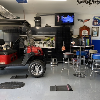 Organized garage with golf cart, bar stools, and storage - L from Cutler Bay, FL