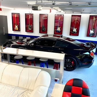 Modern Garage With Black Car Bar Stools and Wall Cabinets - Bruce