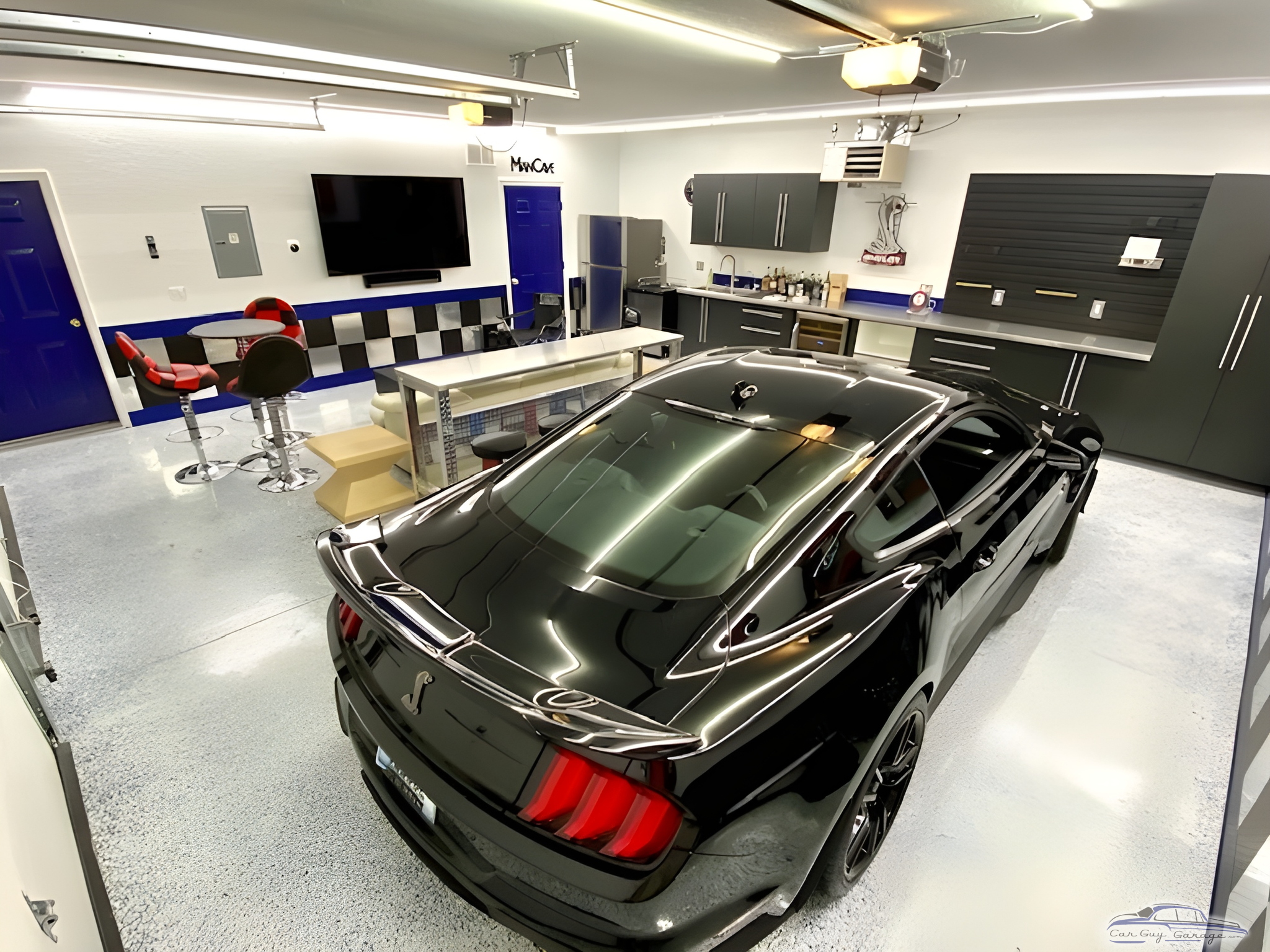 Modern Garage With Cabinets, Bar Stools, and Sports Car - Bruce